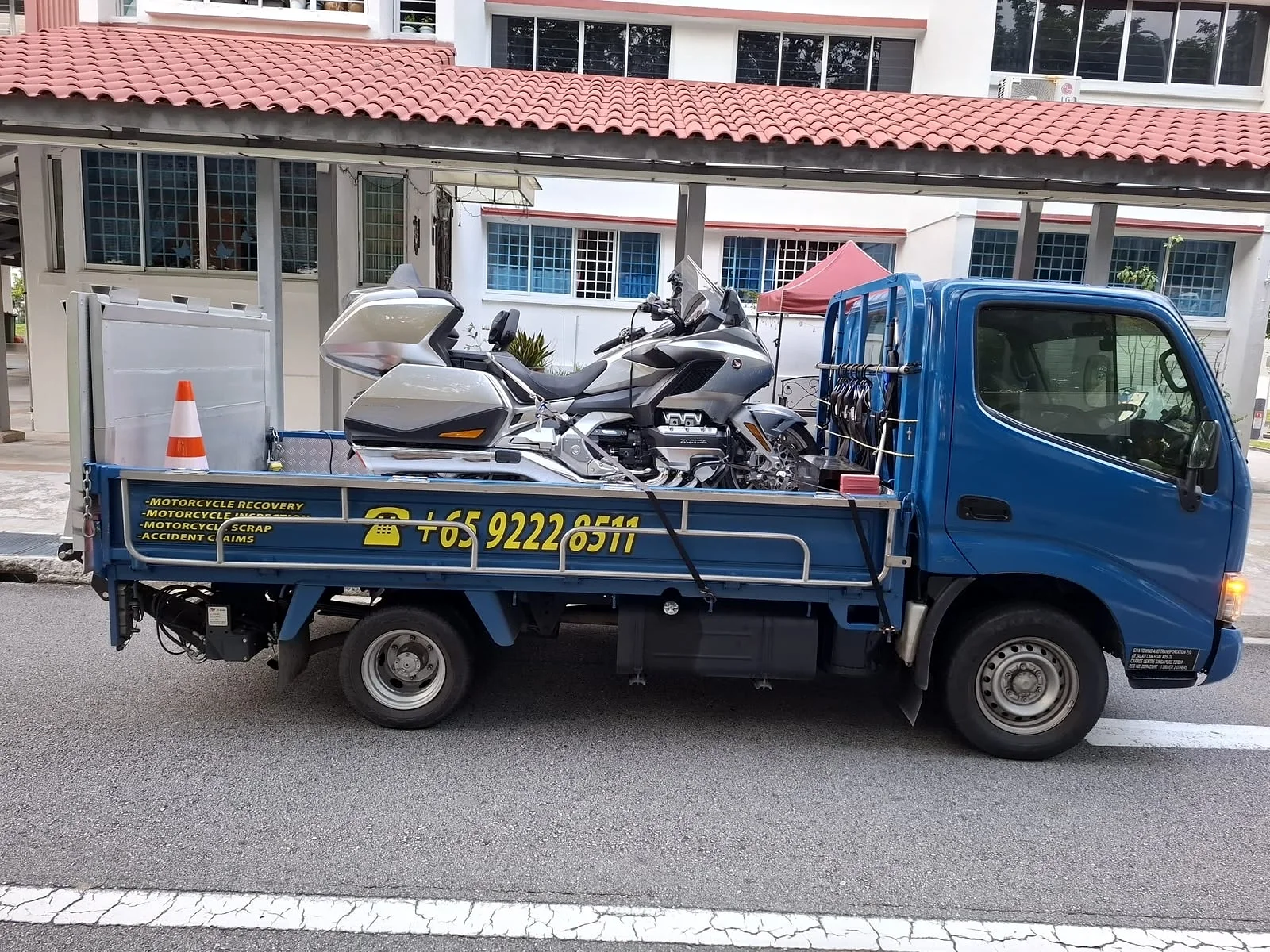 Siva Towing motorcycle recovery lorry on an islandwide transport job
