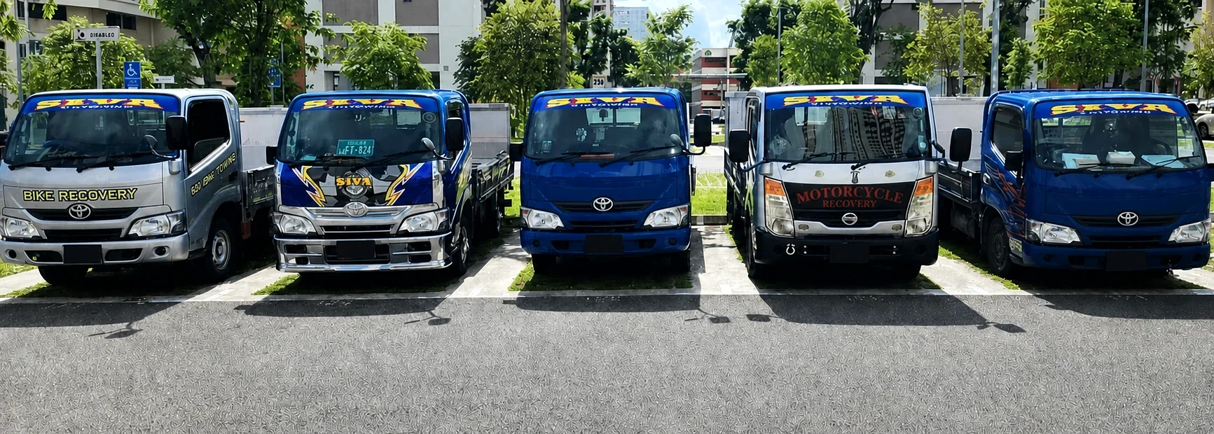 Five specialist Siva Towing motorcycle transport vehicles in Singapore
