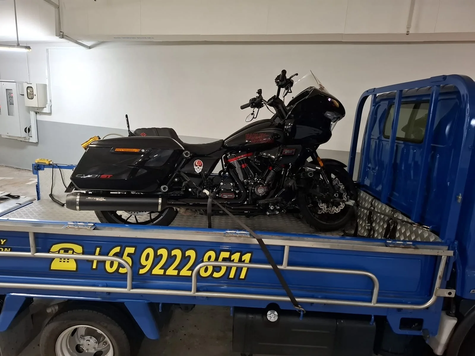 Touring motorcycle secured on a Siva Towing recovery vehicle